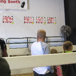 children at the milking booth
