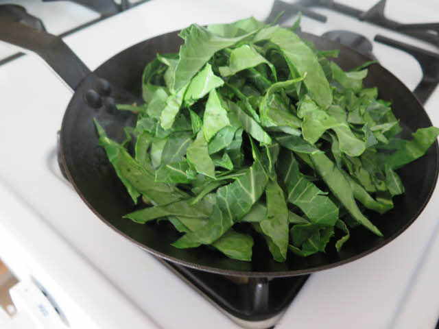 Sliced collards in pan